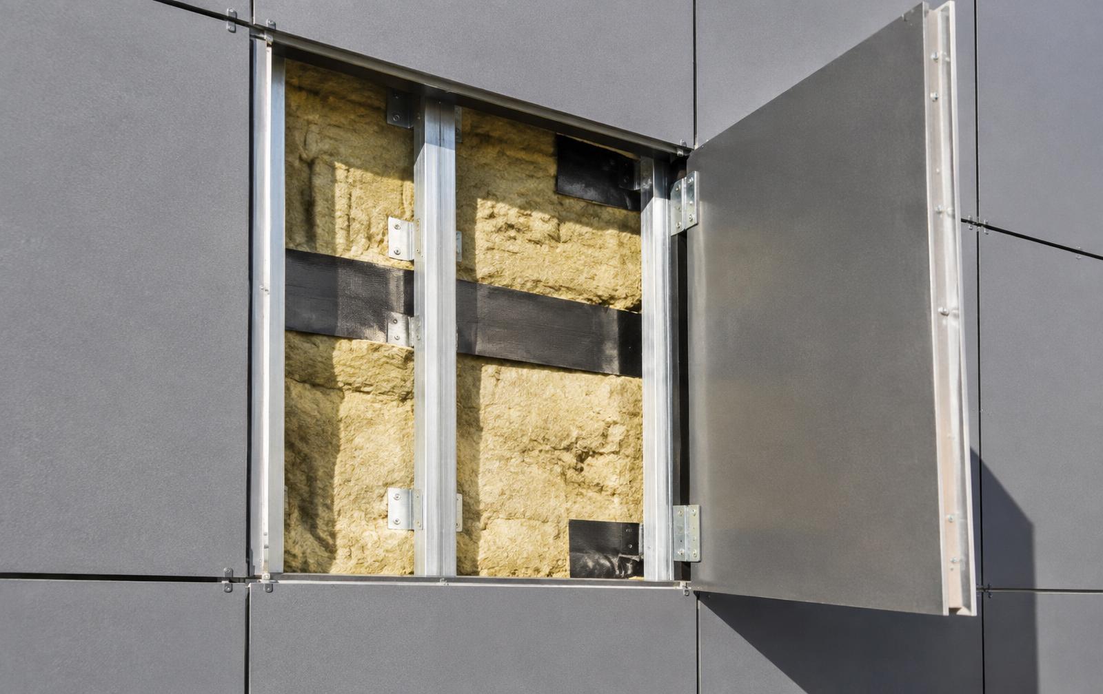 Illustrative facade panel opened to reveal insulation and cavity barriers