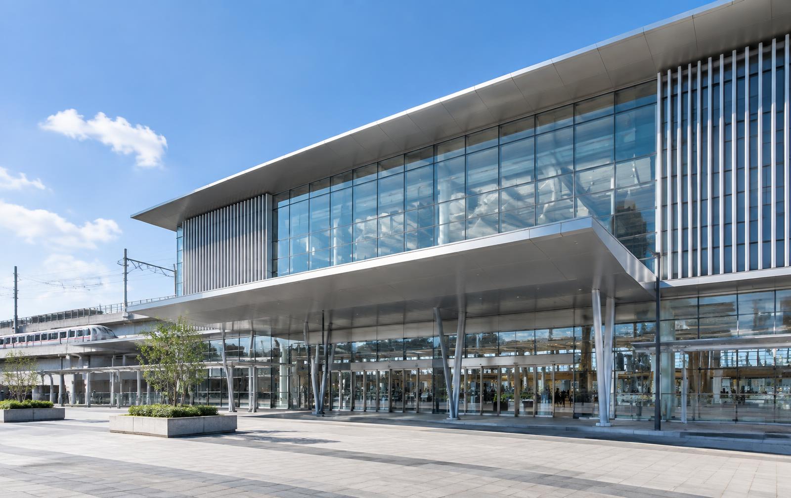 Illustrative modern railway station with glazed curtain wall facade